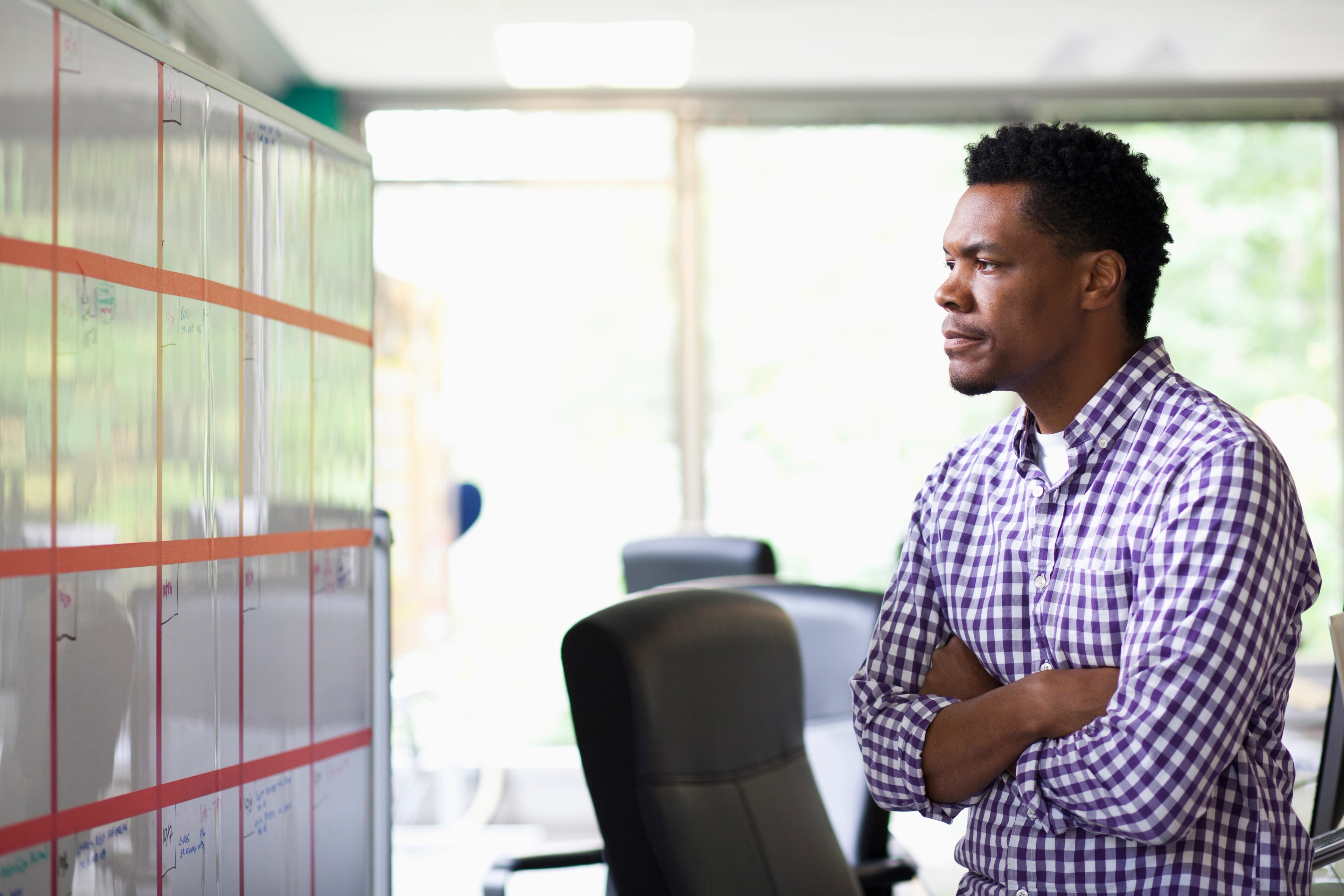 African American businessman reading office calendar