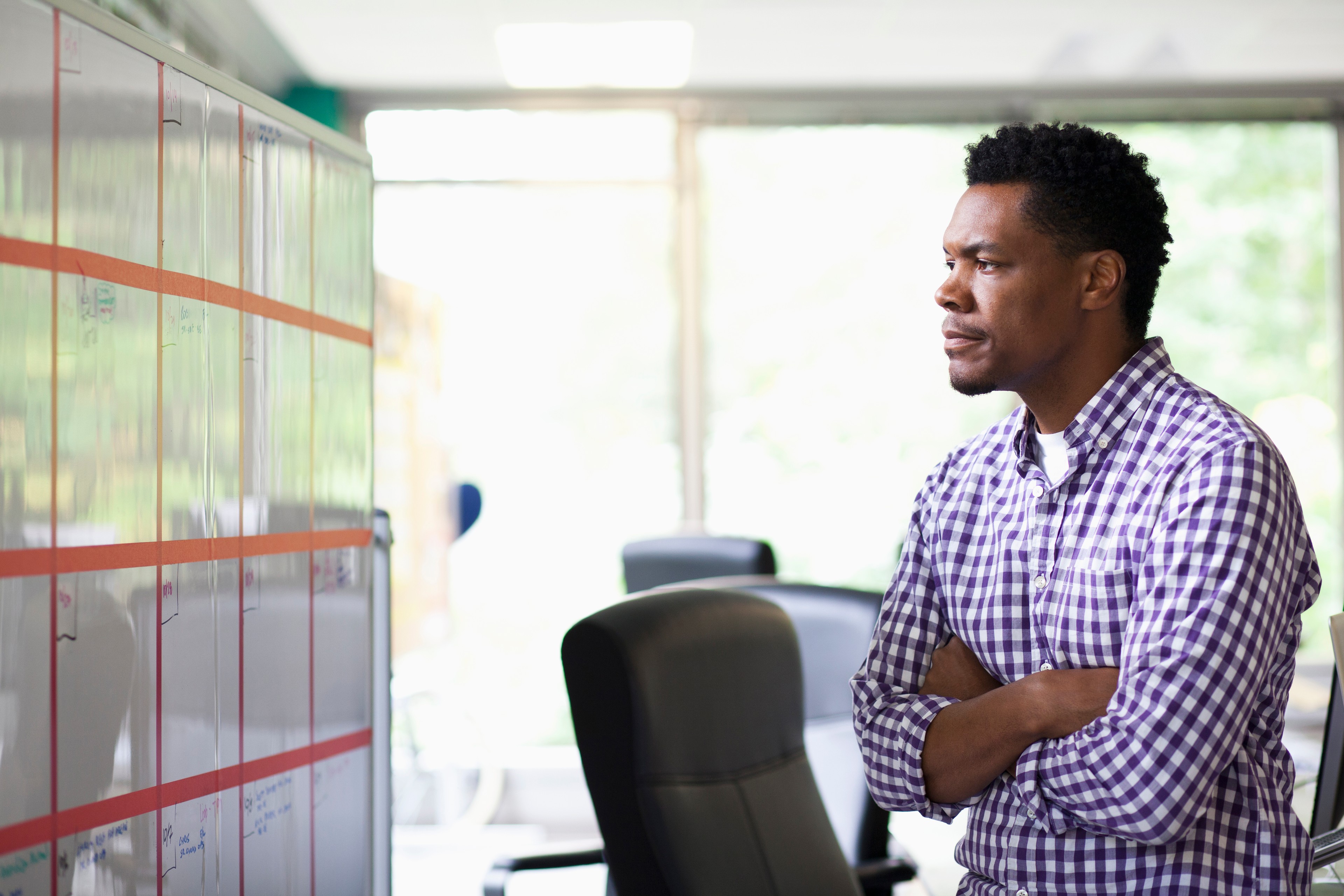 African American businessman reading office calendar