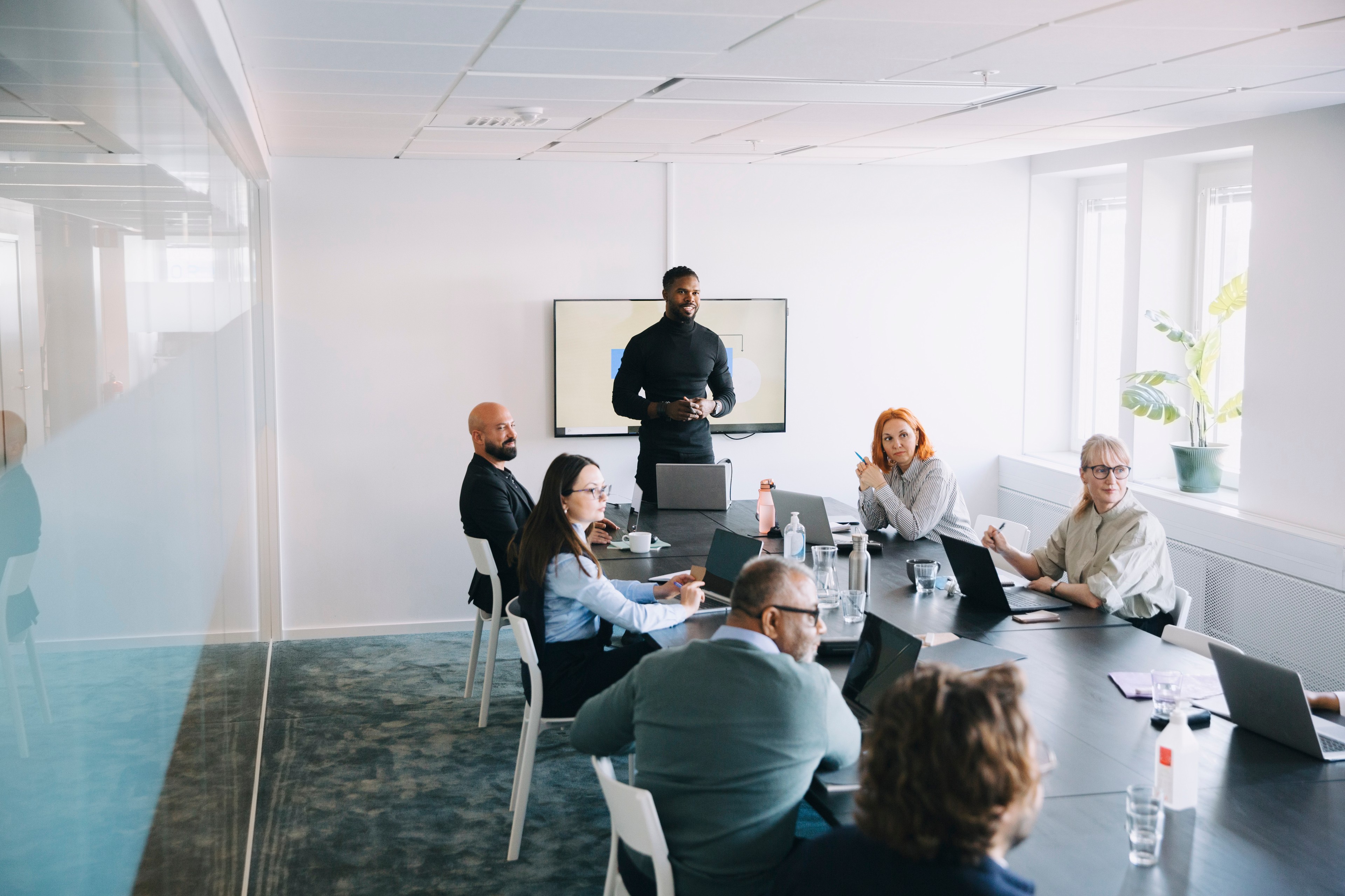 CMMC boardroom meeting with 6 professionals