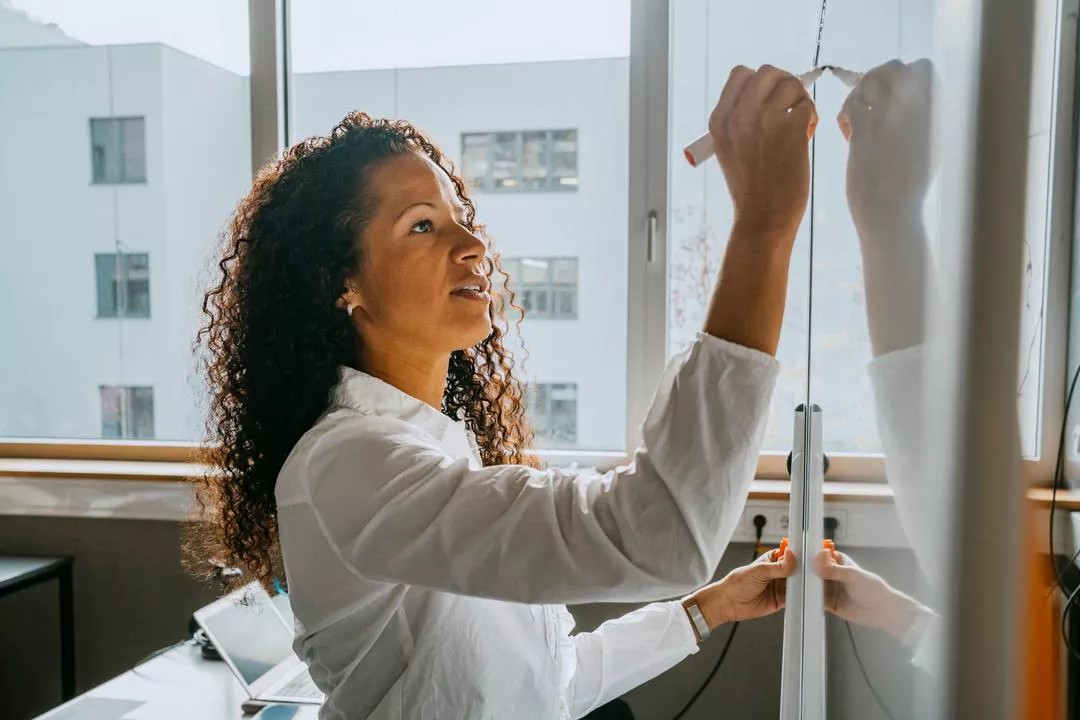 Woman planning strategy for presenting on cyber risk to the board