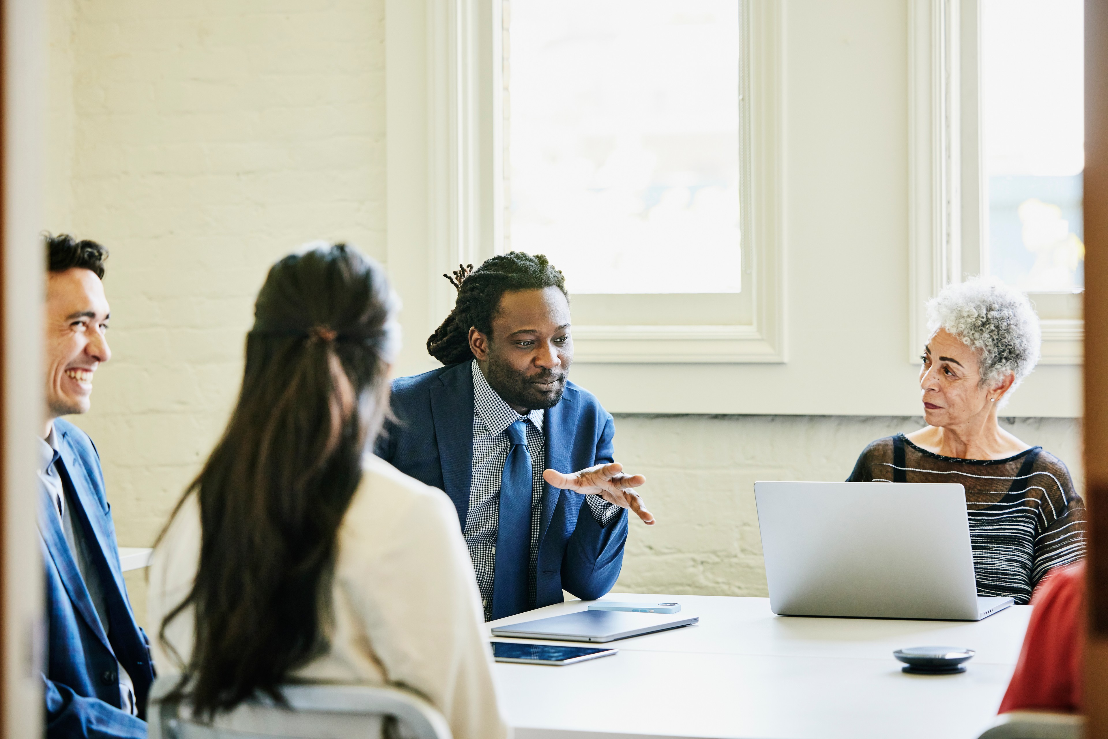 businessman leading team meeting in conference room
