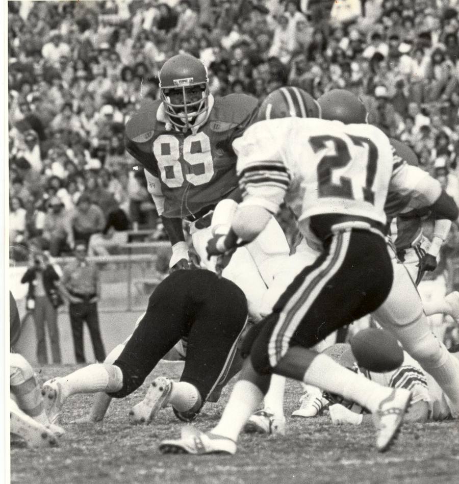 Ricky Hunley, No. 89, closing on the play