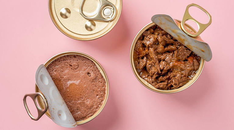 alt text: canned dog food being scooped out