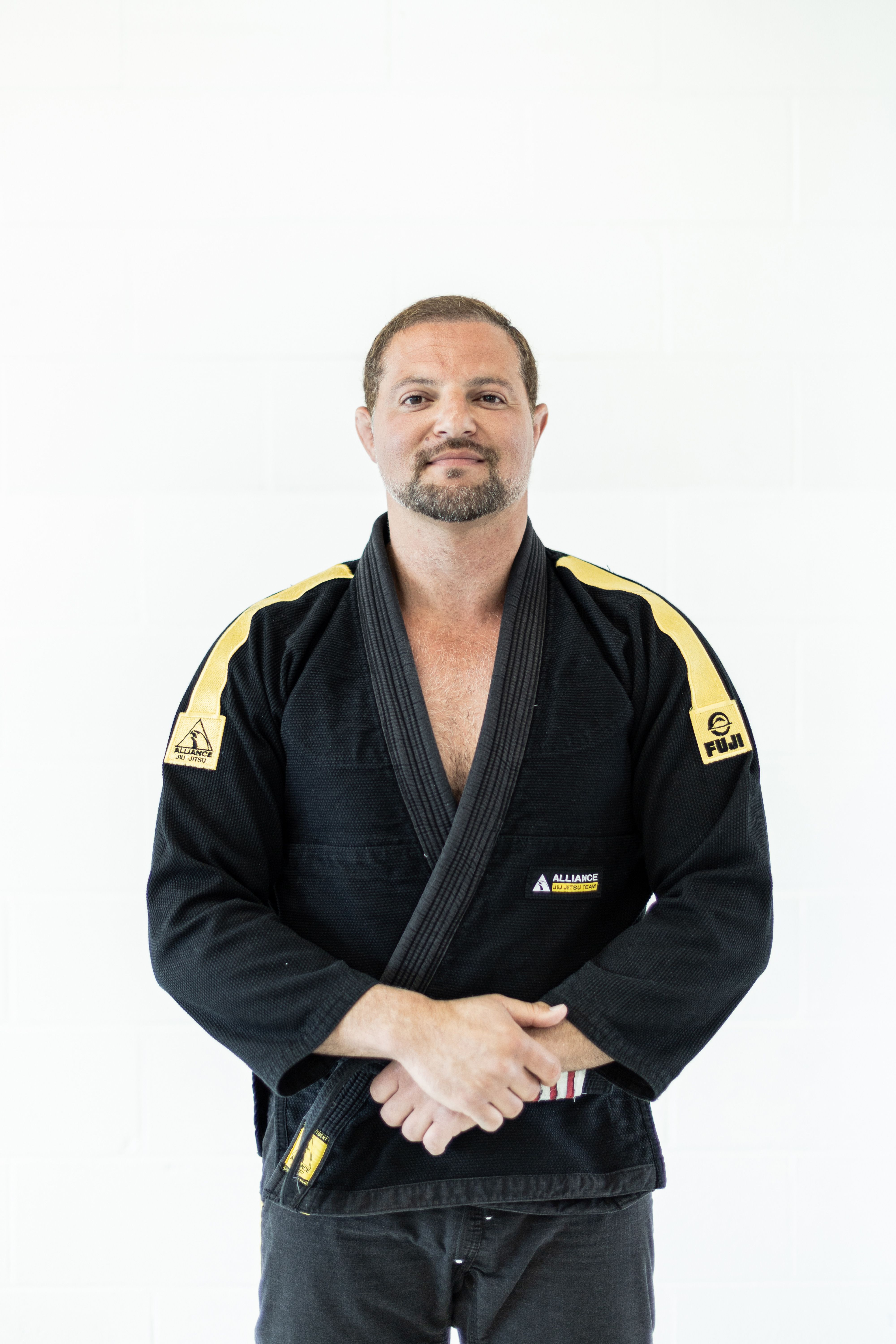 Via Jiu Jitsu instructor standing on the mat