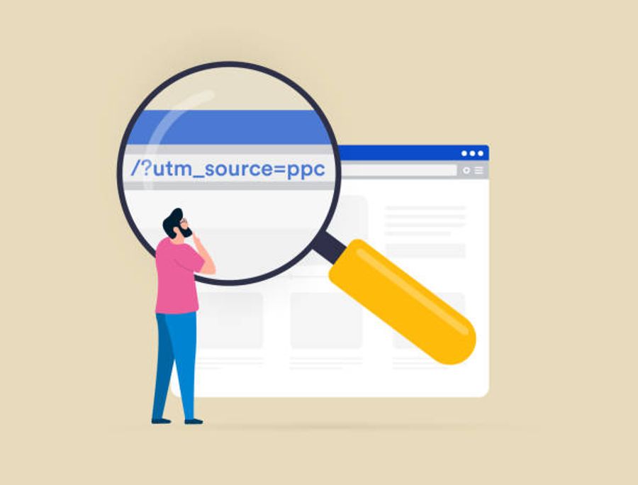 Person holding a magnifying glass up to a browser window zoomed in on a UTM parameter in a URL
