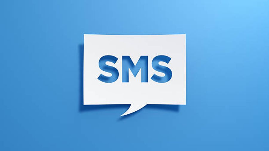 White speech bubble with SMS text on a blue background representing text message marketing