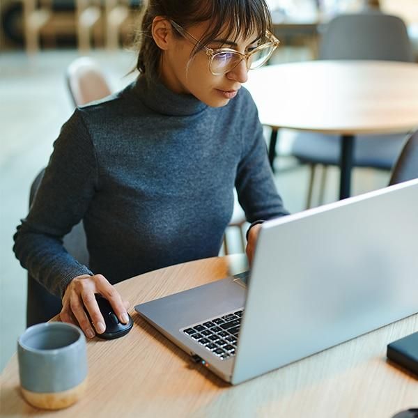 Software developer working on a laptop in a modern workspace, illustrating efficient app development with Google DevTools and Flutter.