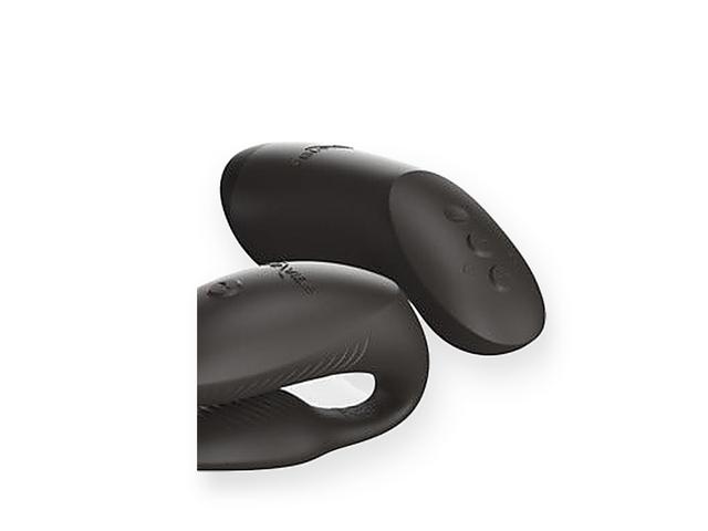 The We-Vibe Chorus Pro couples vibrator and its haptic squeeze remote, shown close in matte black silicone against a bright white background.