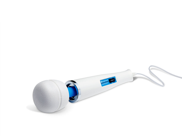 The Magic Wand Original Corded Personal Massager HV-260 on white paper, its broad domed head angled toward the camera and the long handle trailing away, showing why a wand spreads vibration across a wide patch of skin instead of one point.