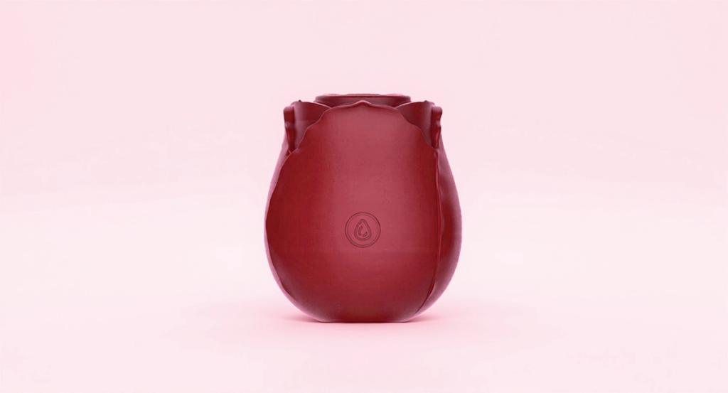 Rose-shaped suction vibrator on a pale blush ground