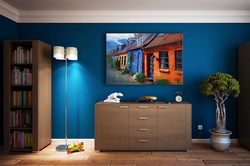 A painted basement room with rich, blue walls