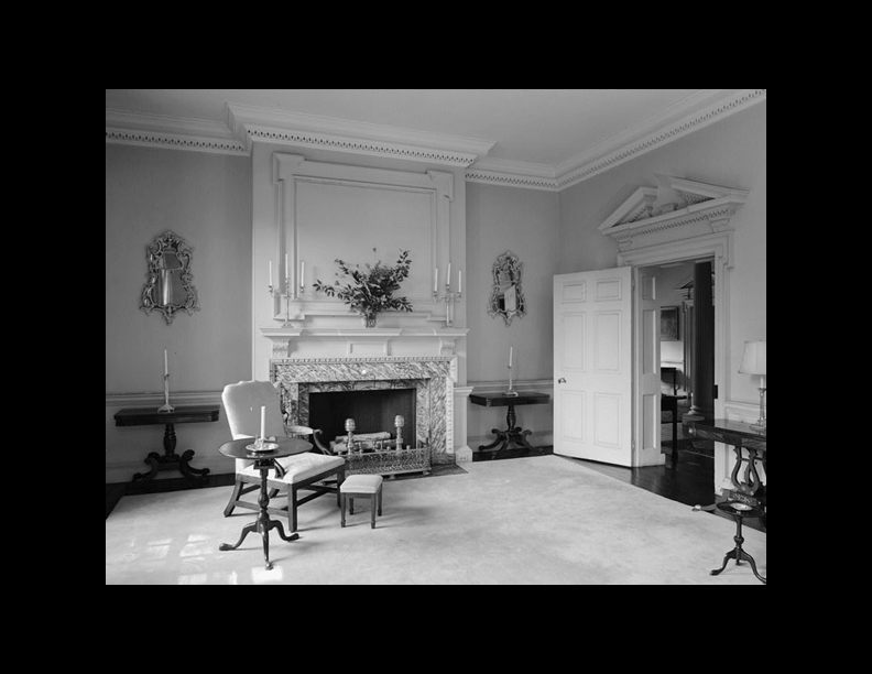 A black and white photo of a room that uses georgian molding