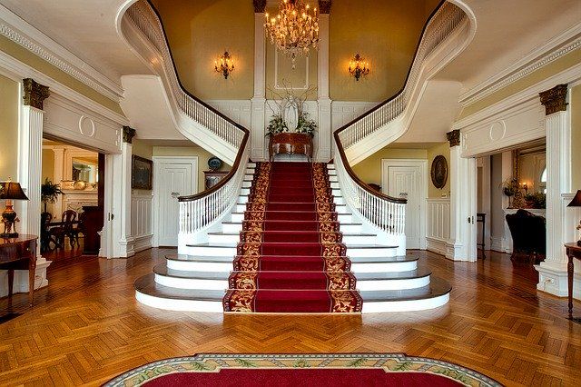 A large staircase in a home with a high ceiling