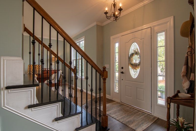 An entryway with a beautifully painted front door