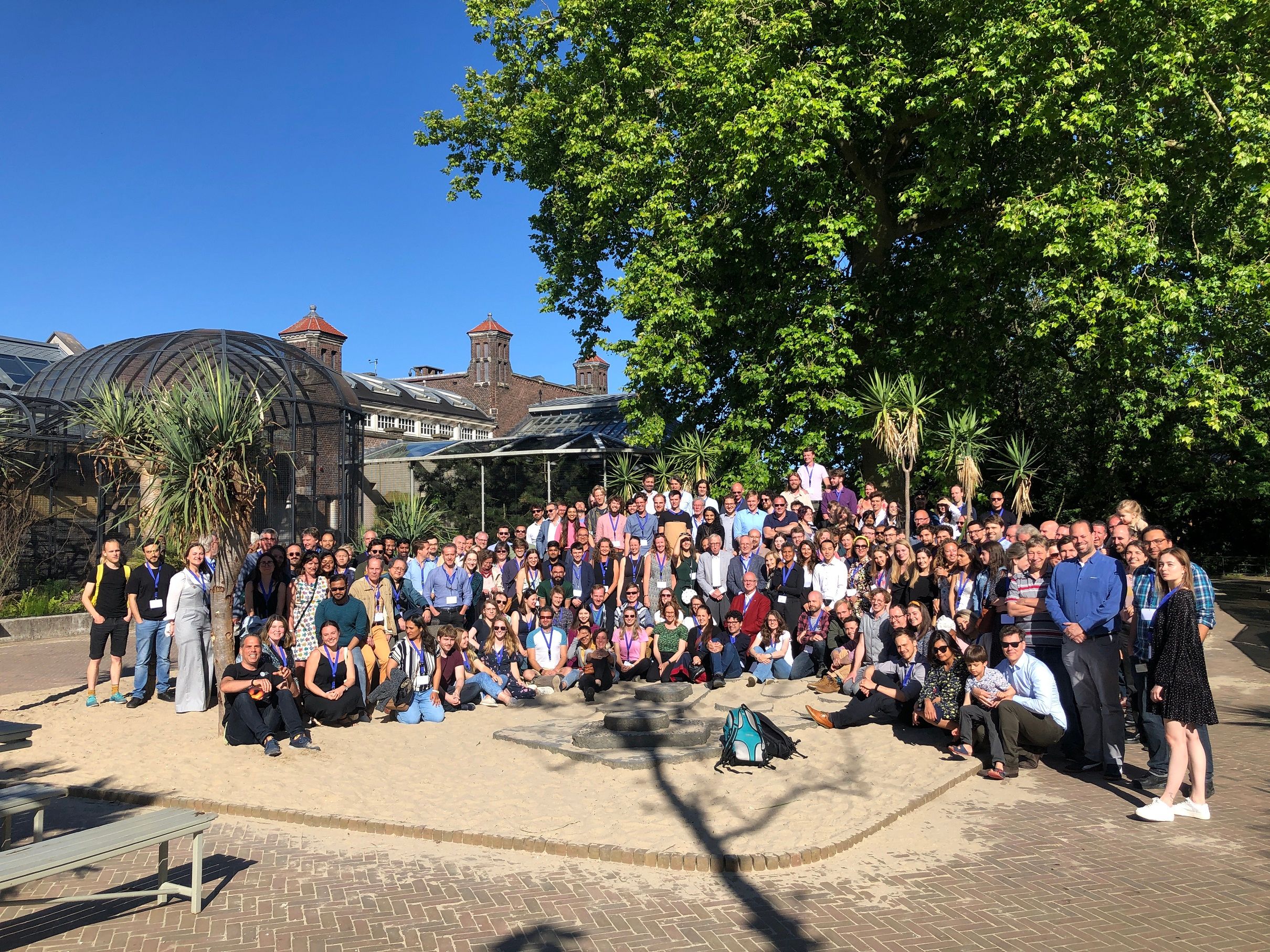 A group photo of about 150 people on a sunny day