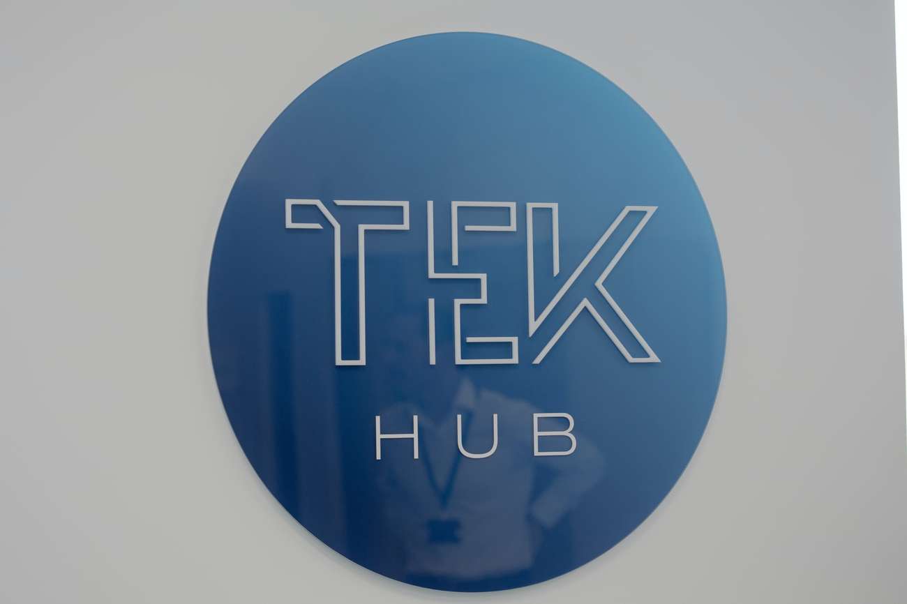 Circular Tek hub logo on wall