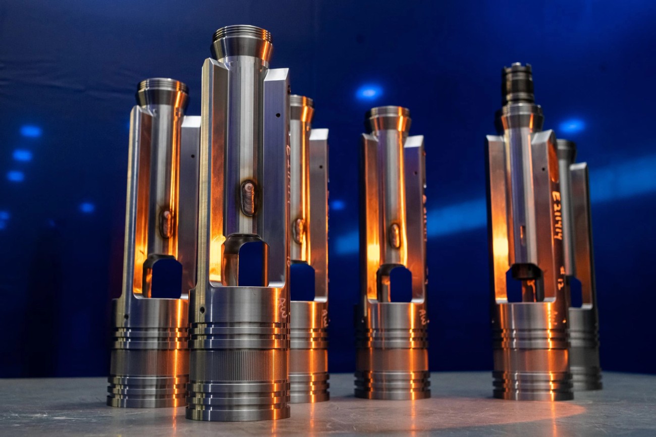 Multiple metal tools standing on table with blue background and orange light