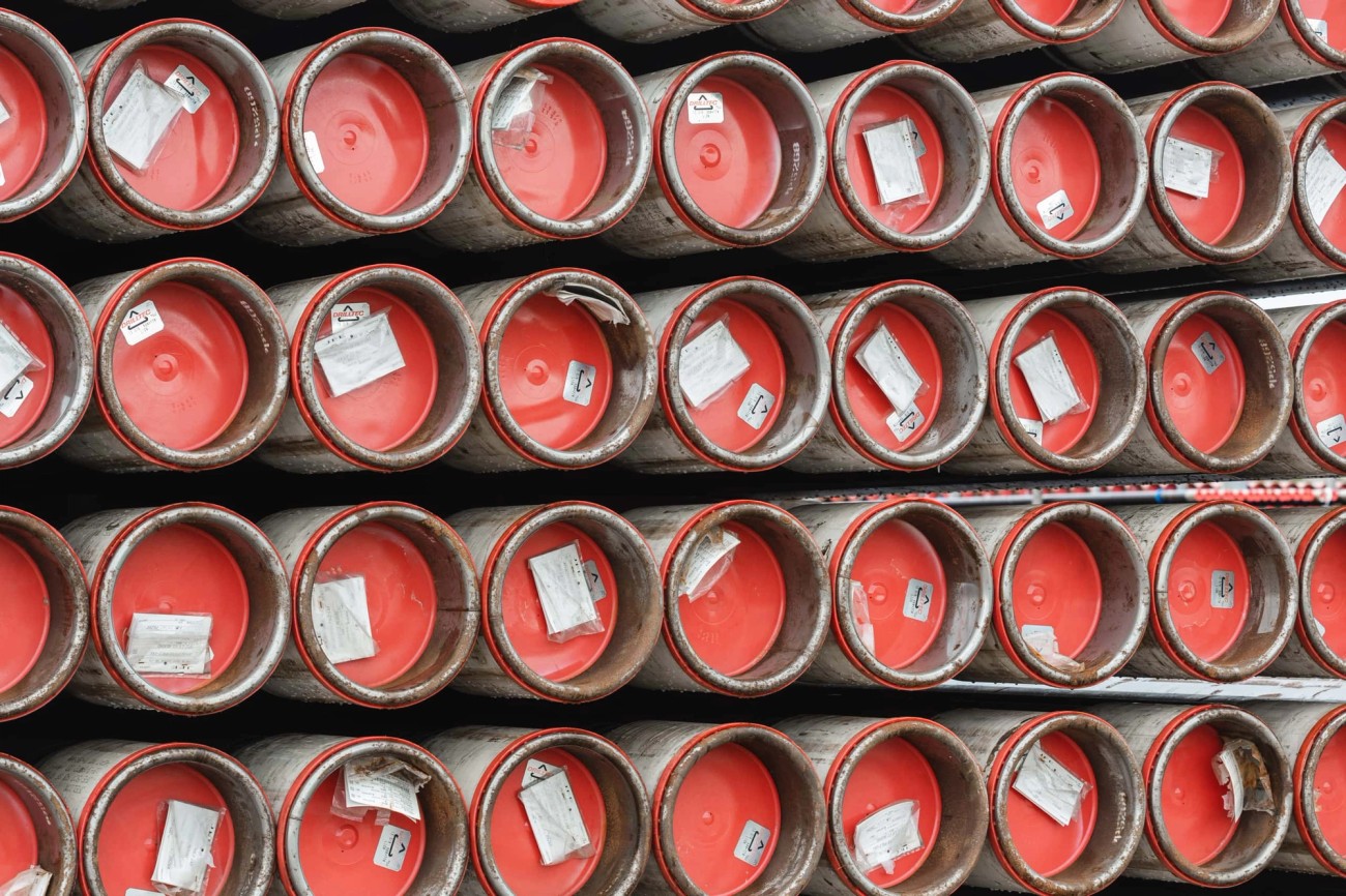 Stacked pipes with red caps