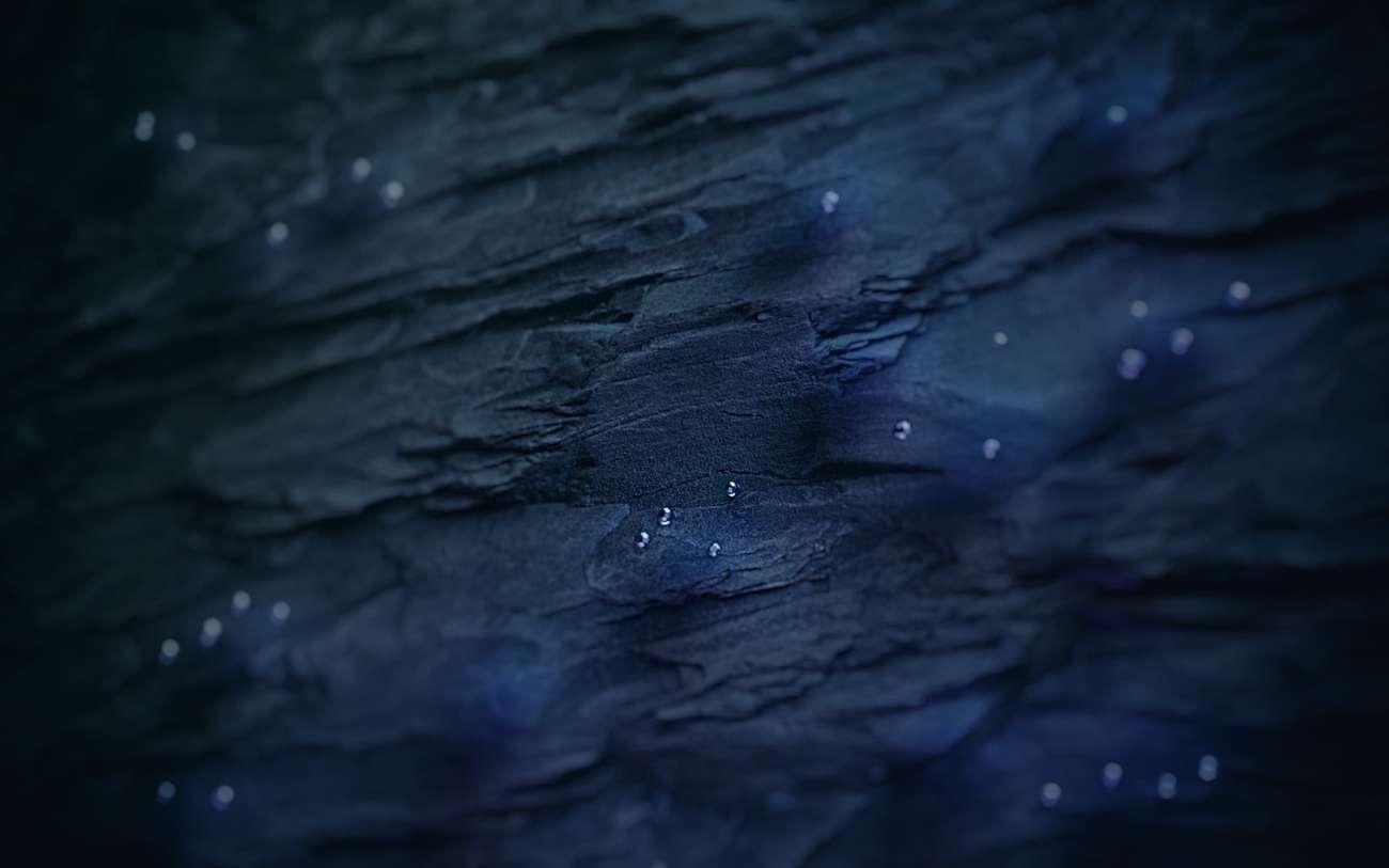 Abstract rendering of rock and oil drops under water
