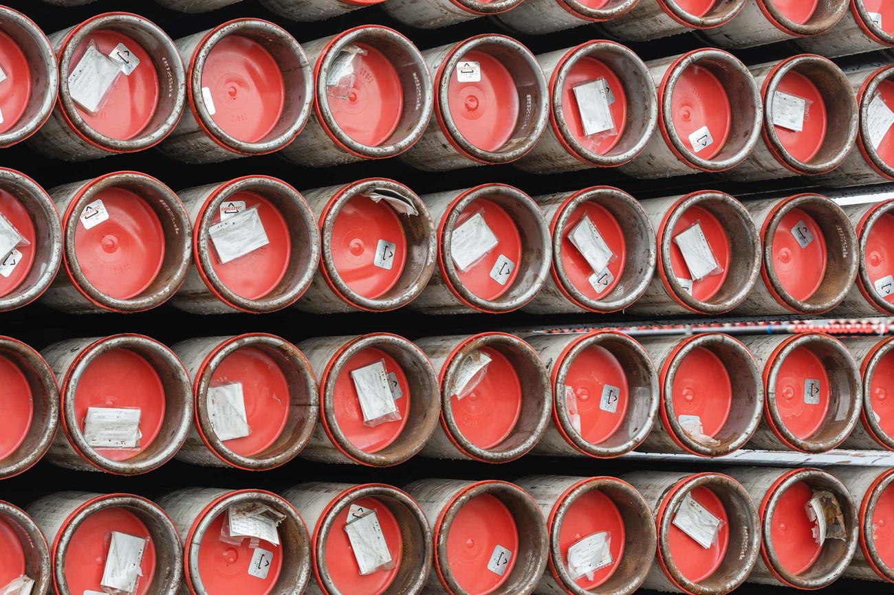 Stacked pipes with red caps