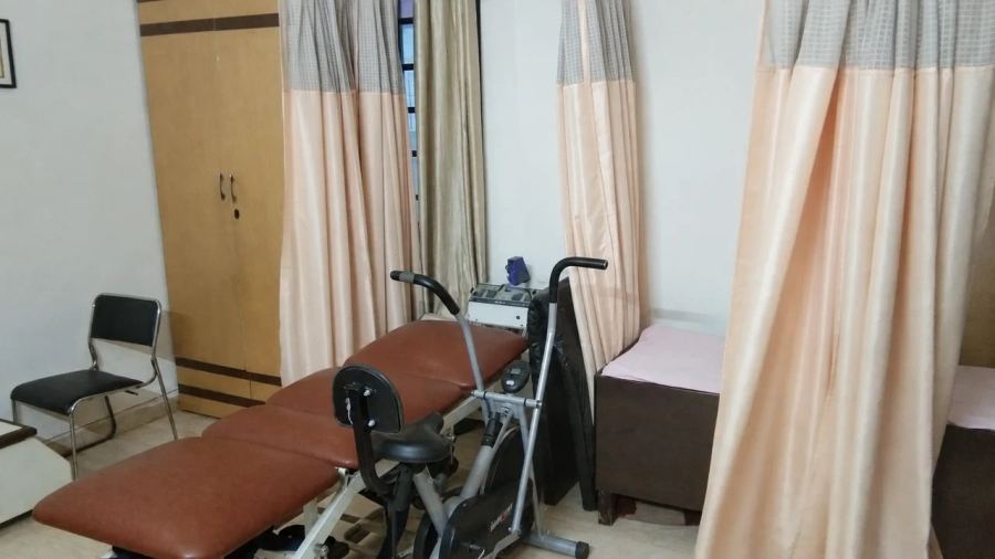 Treatment table and physiotherapy equipment inside the clinic