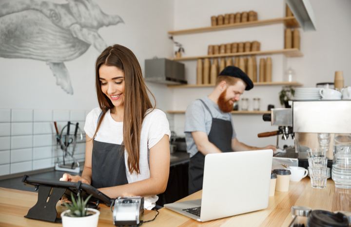 Coffee shop workers managing social media