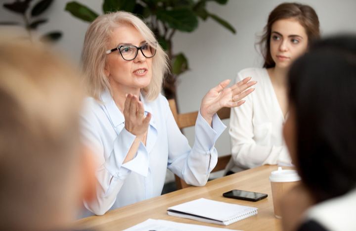 Old woman in a business meeting