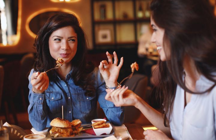 Friends living a great experience in a restaurant