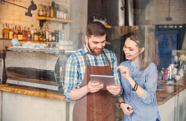 Restaurant workers handling reservations online