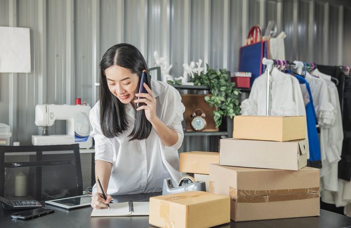 Woman entrepreneur stocking her products