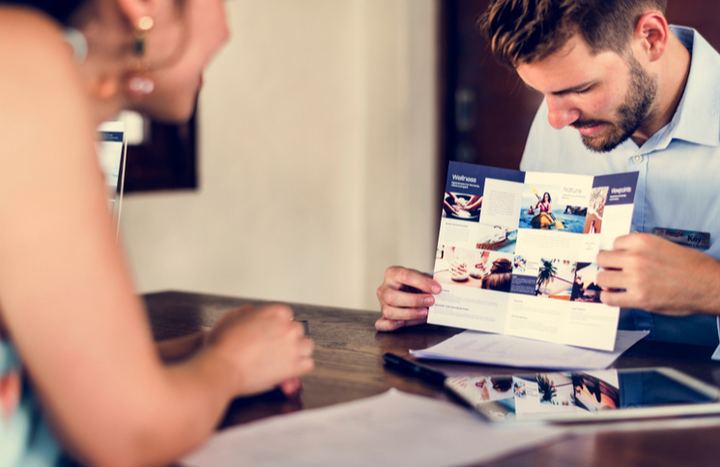 Man showing a brochure