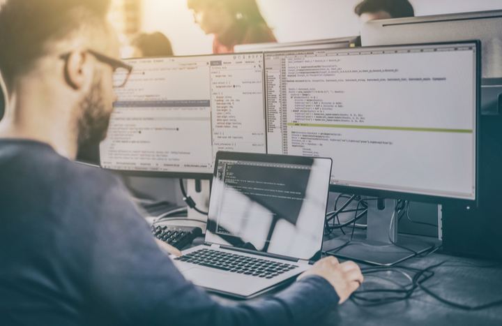 Man coding in order to build a website