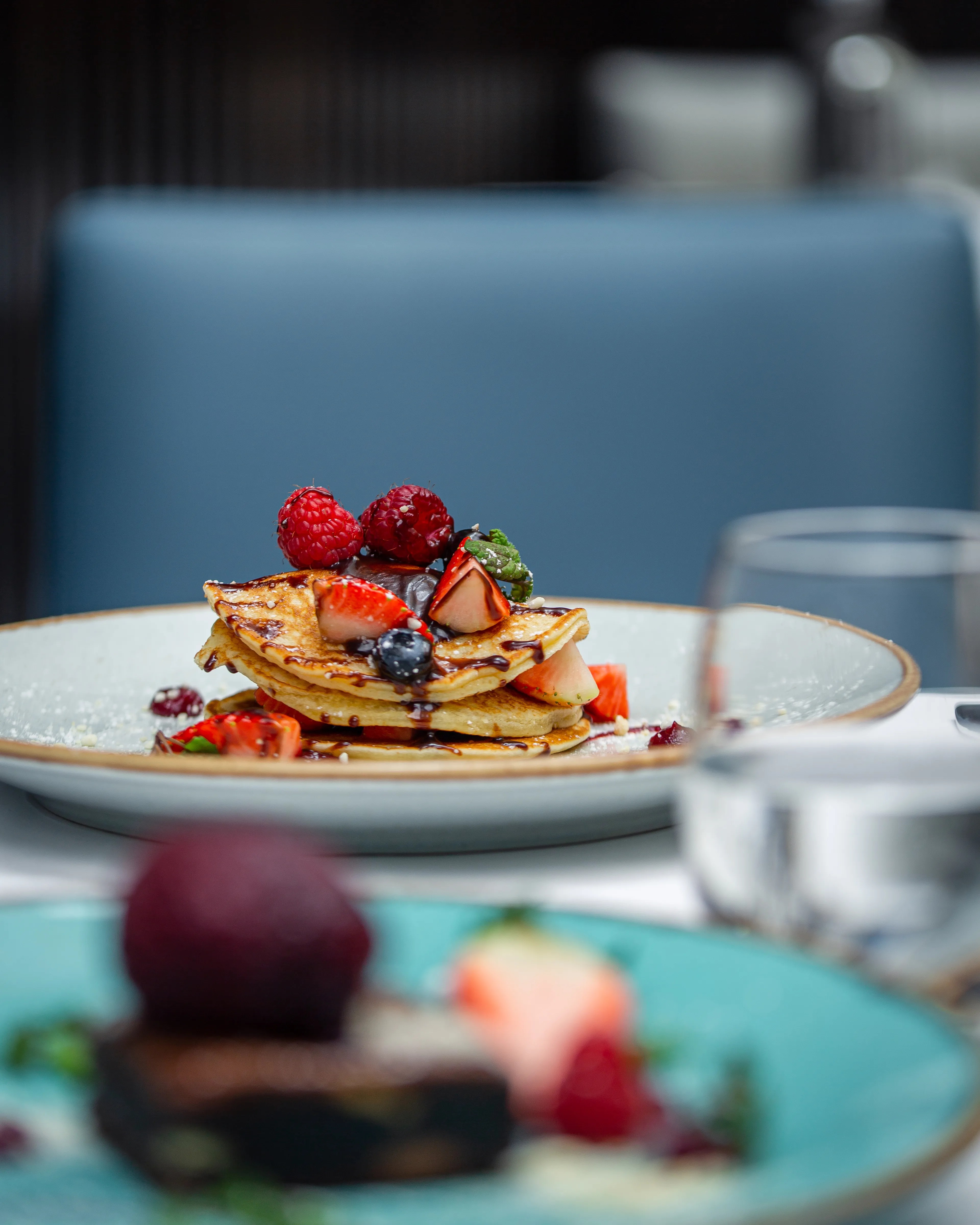 Pancake stack with fresh berries and fruit compote at The Brasserie