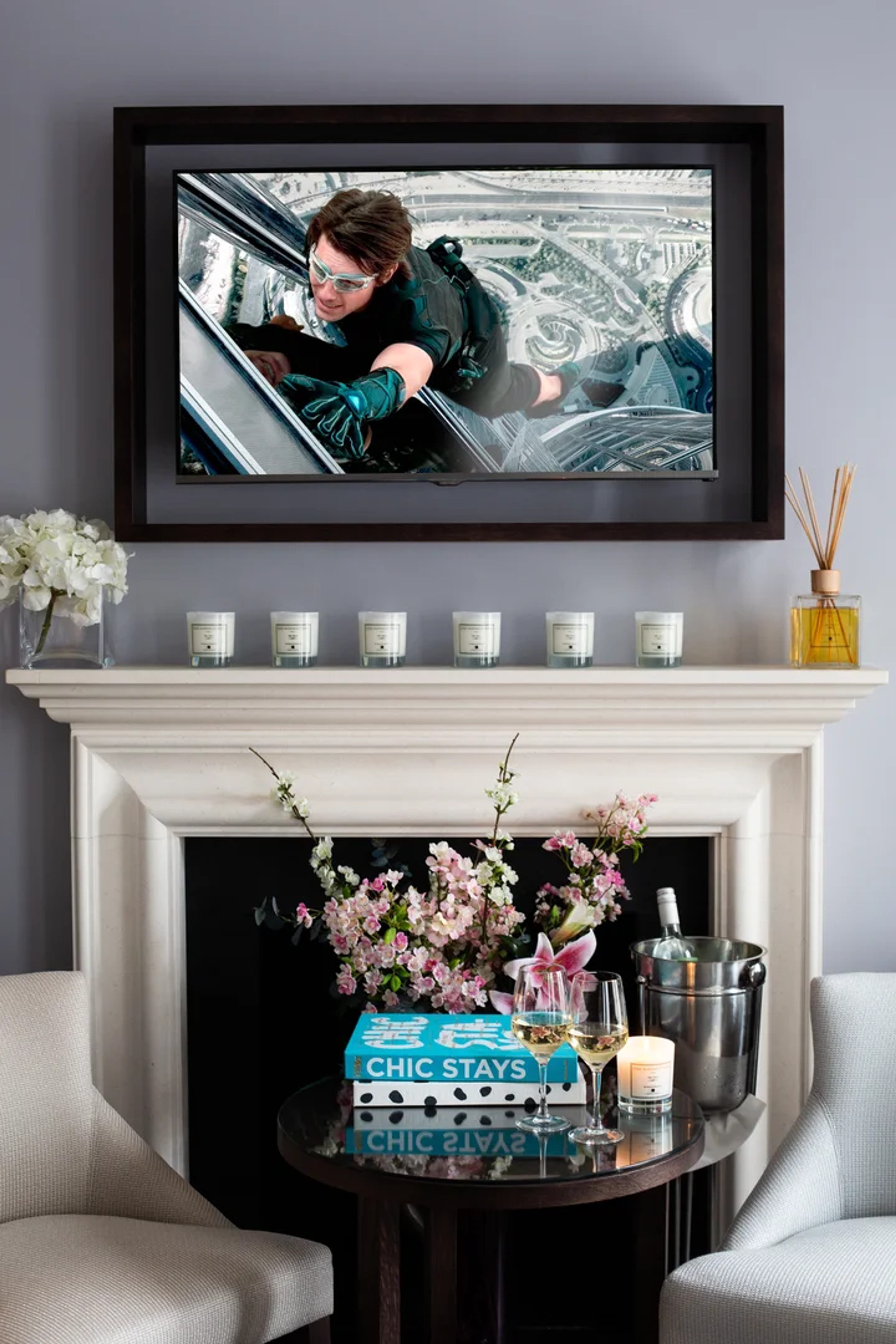 Deluxe Room seating area with armchair and side table