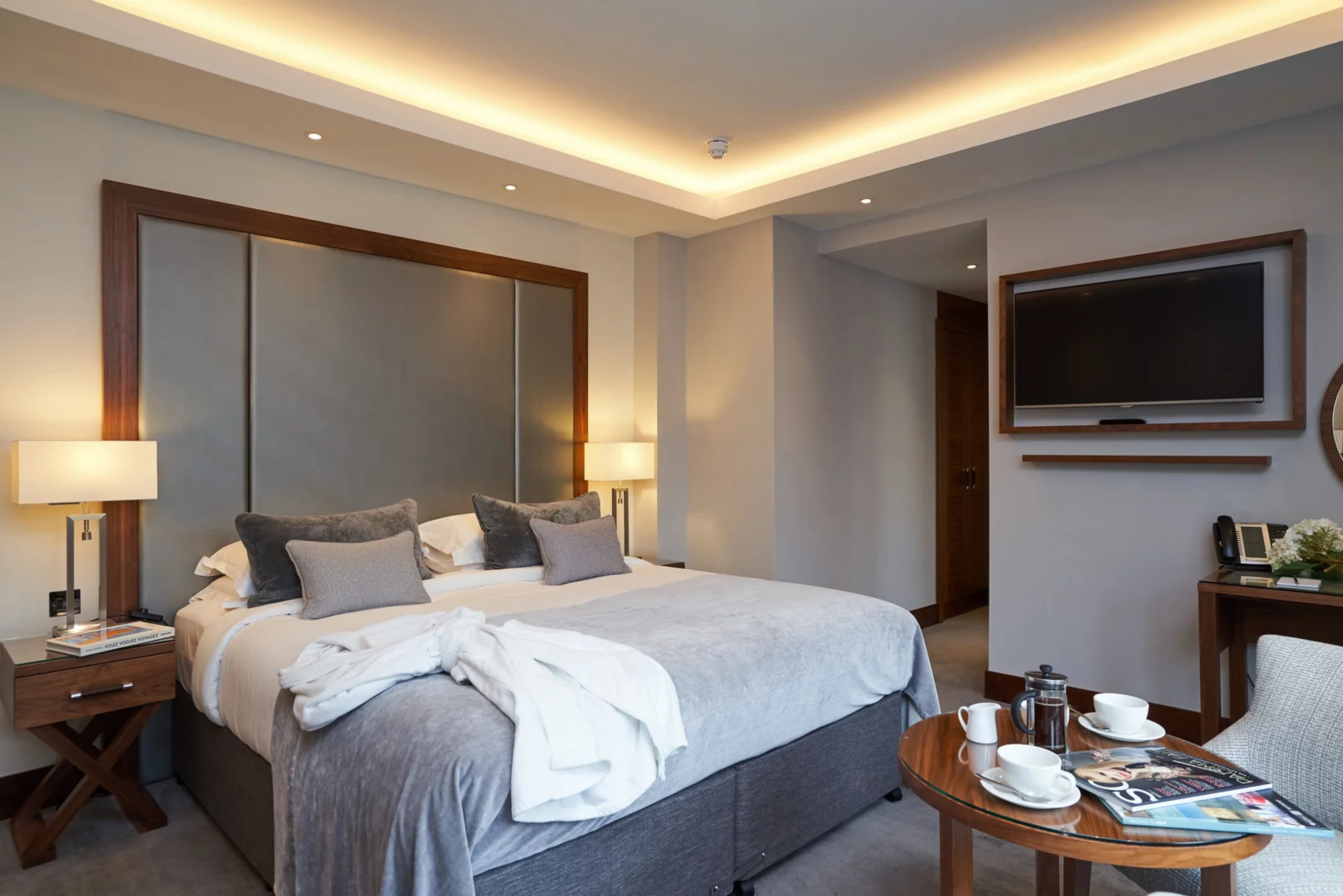 Spacious Deluxe Plus Room with premium furnishings and modern amenities