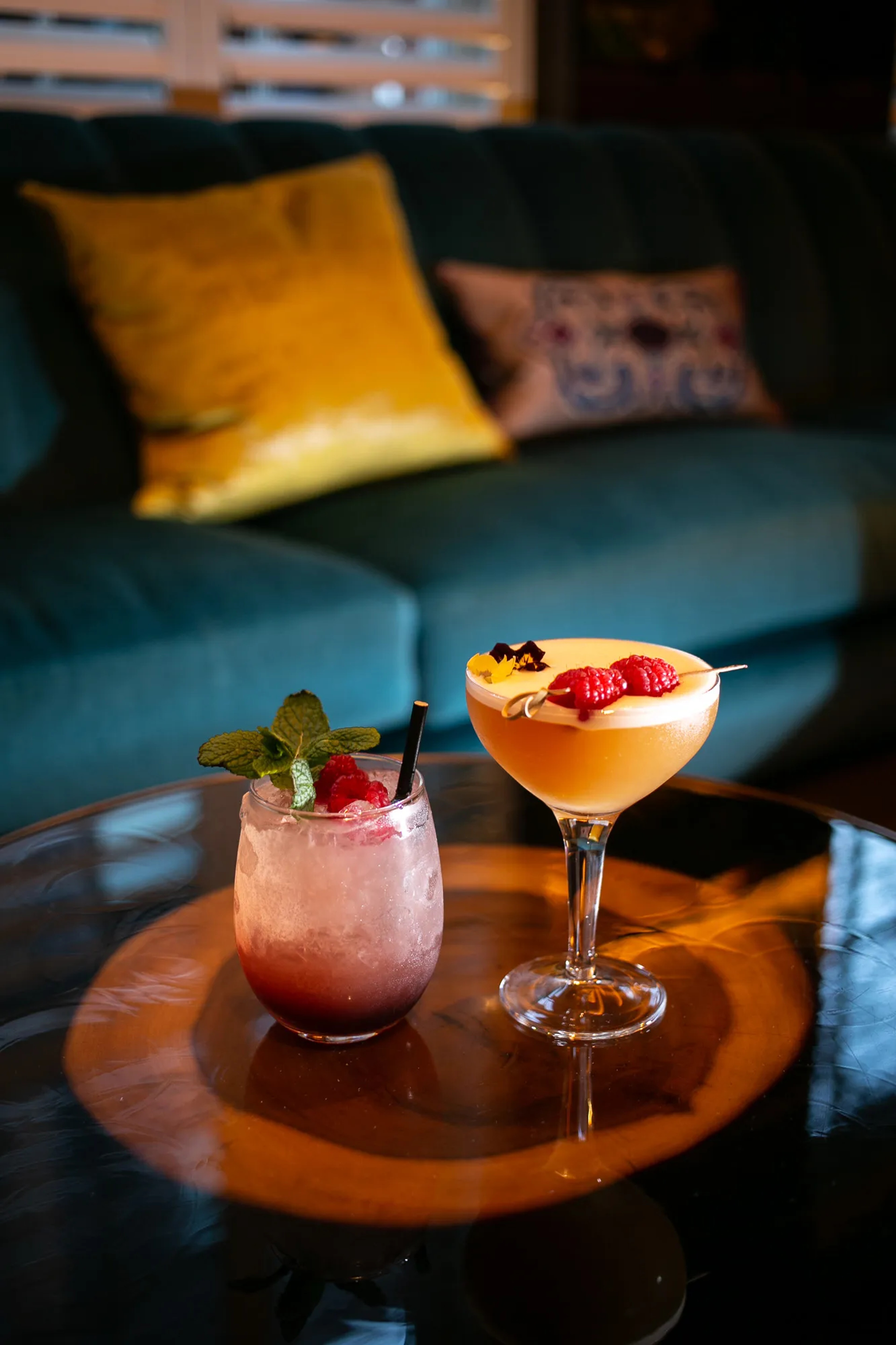 Beautifully crafted signature cocktails on velvet seating at The Bar, One Warwick Park