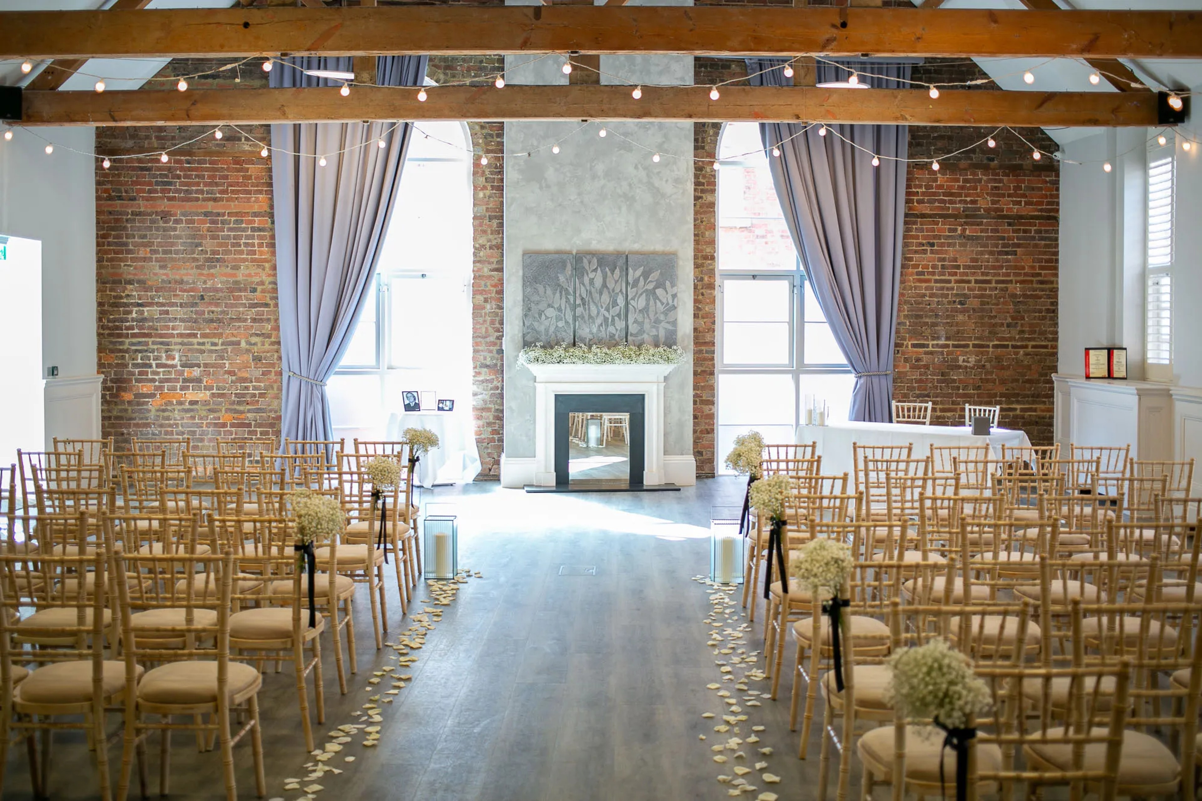 Beautiful ceremony details with flowers and lighting