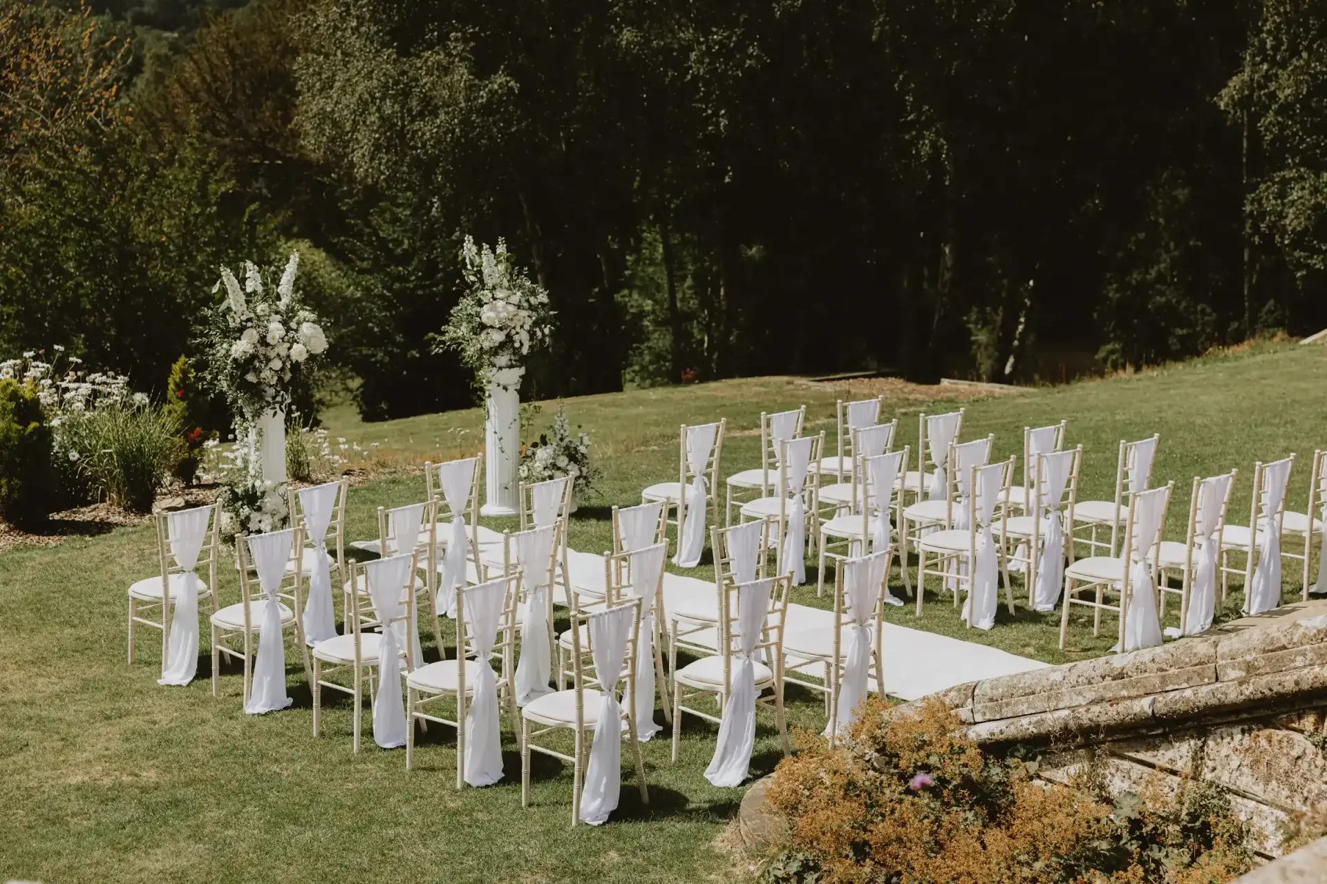 Outdoor wedding ceremony setup in the gardens at Salomons Estate