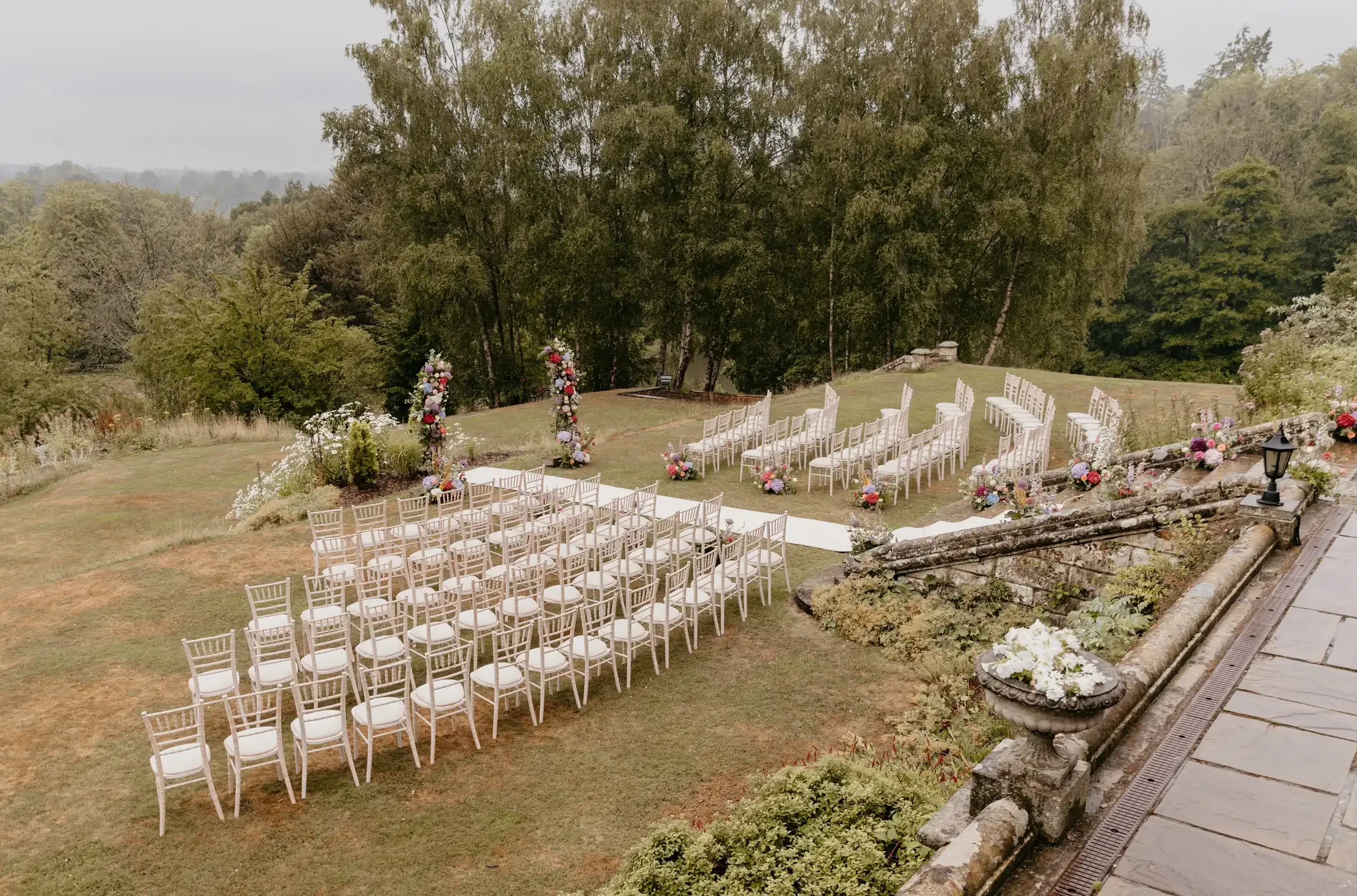 Outdoor wedding ceremony with floral arch at Salomons Estate