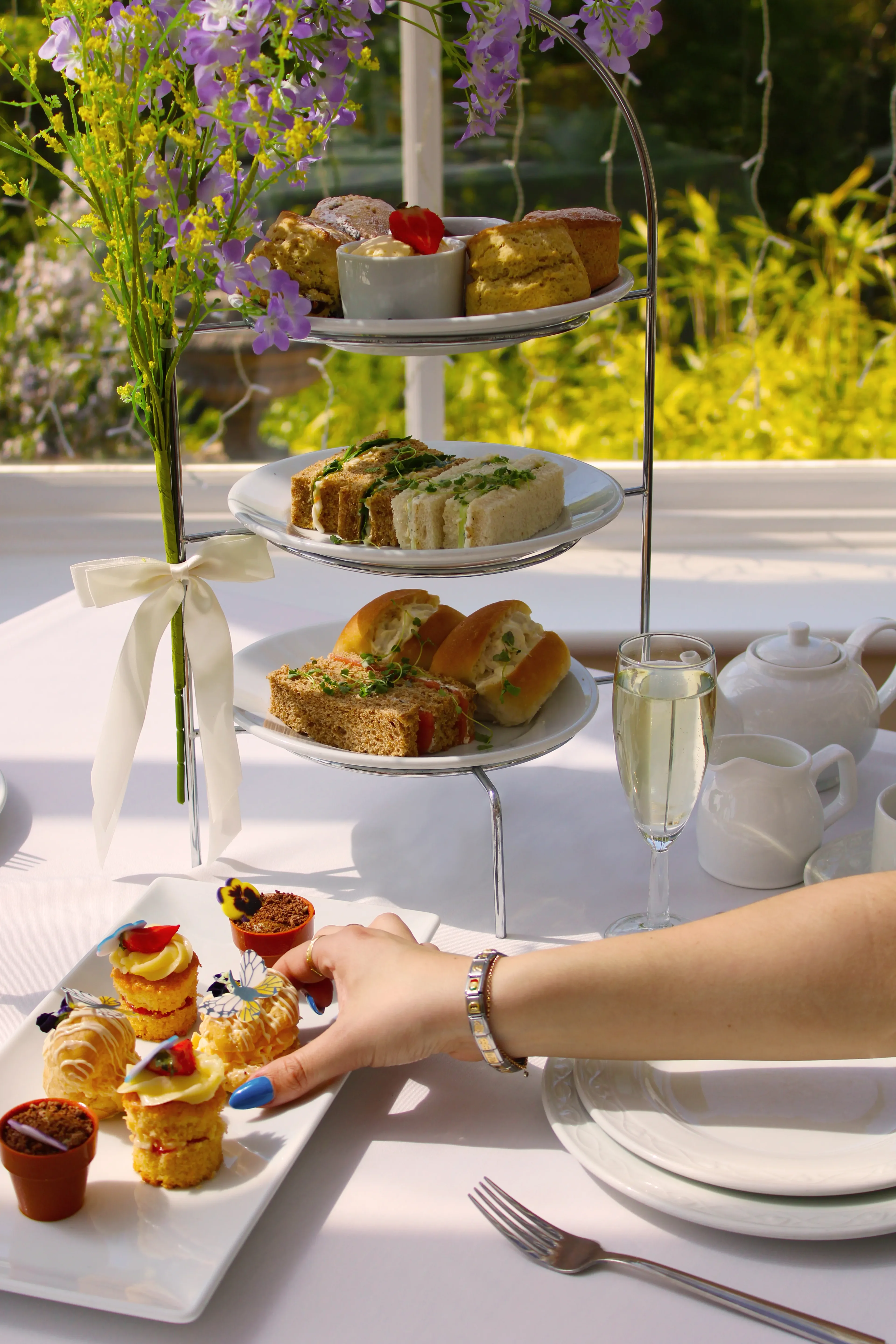 Guests enjoying afternoon tea treats during a hen party celebration at Salomons Estate