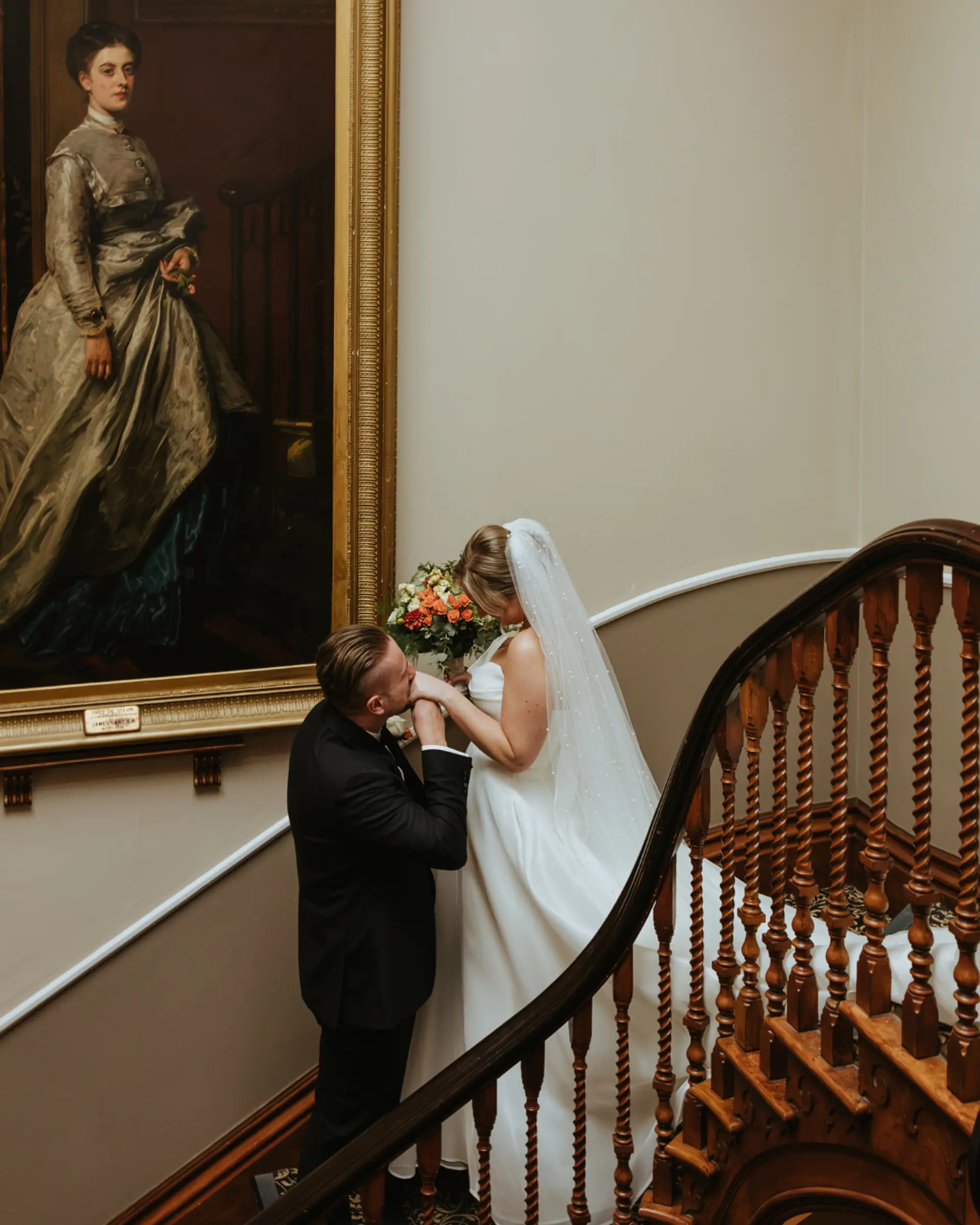 Bride and groom on Salomons Estate's grand Victorian staircase