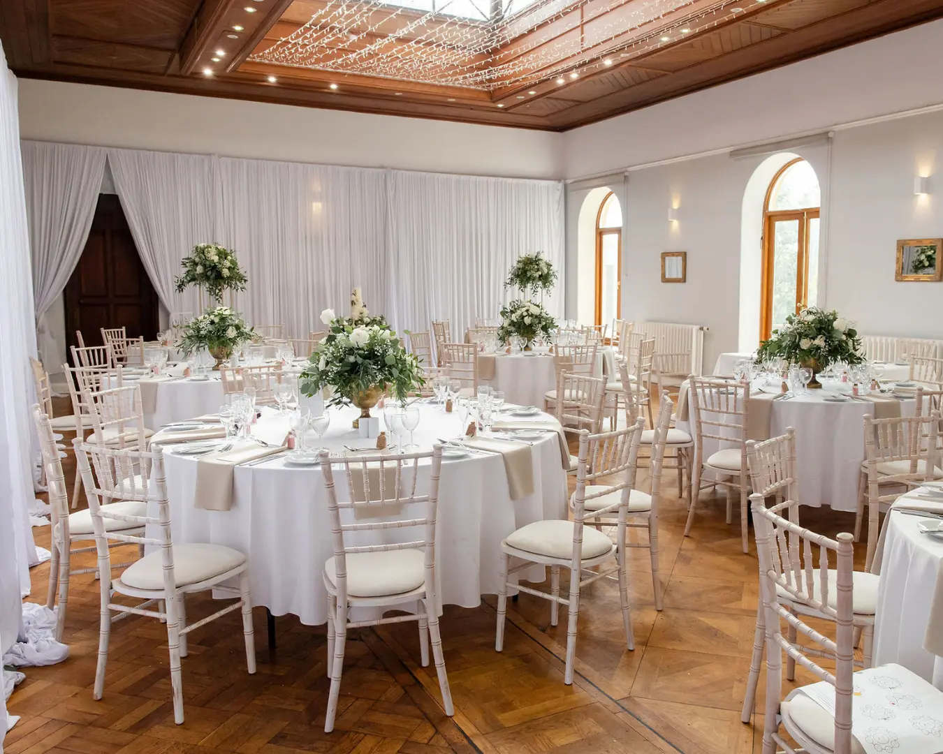 Wide view of wedding reception tables in the Theatre at Salomons Estate