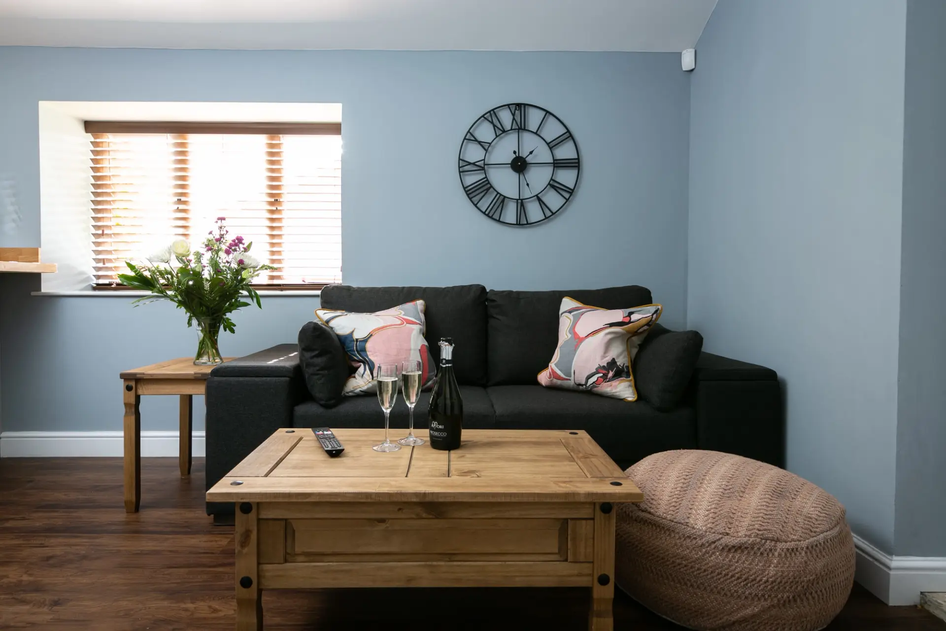 Living room with a sofa, coffee table and countryside views at The Cottage, Salomons Estate