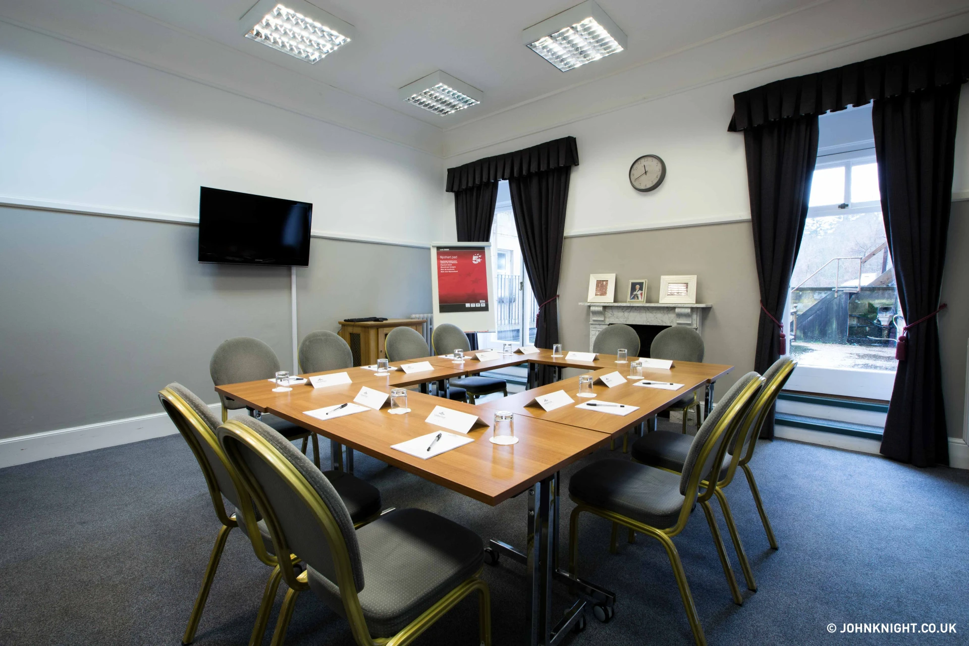 Boardroom meeting setup with branded stationery at Salomons Estate