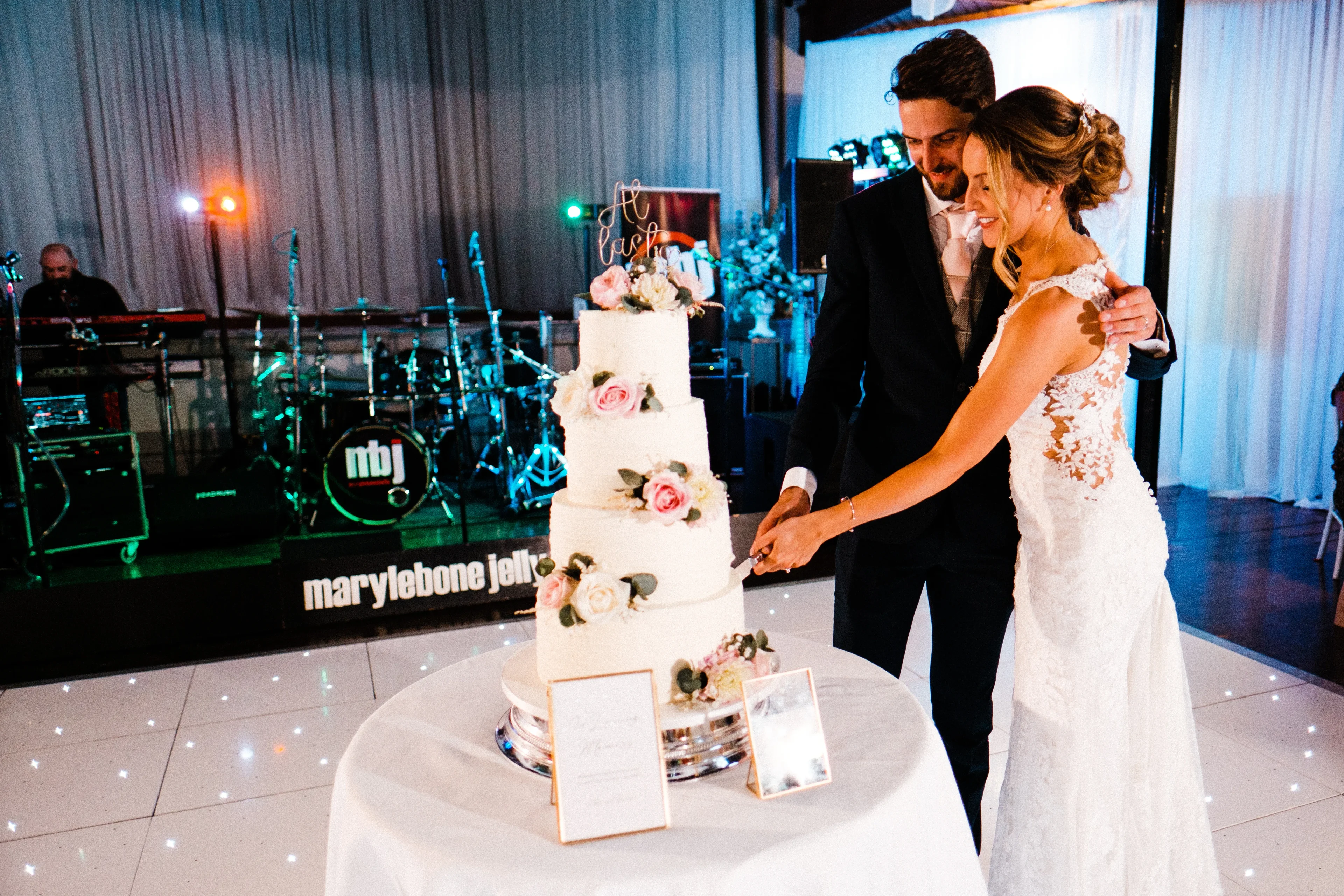 Cake cutting and first dance at Salomons Estate wedding