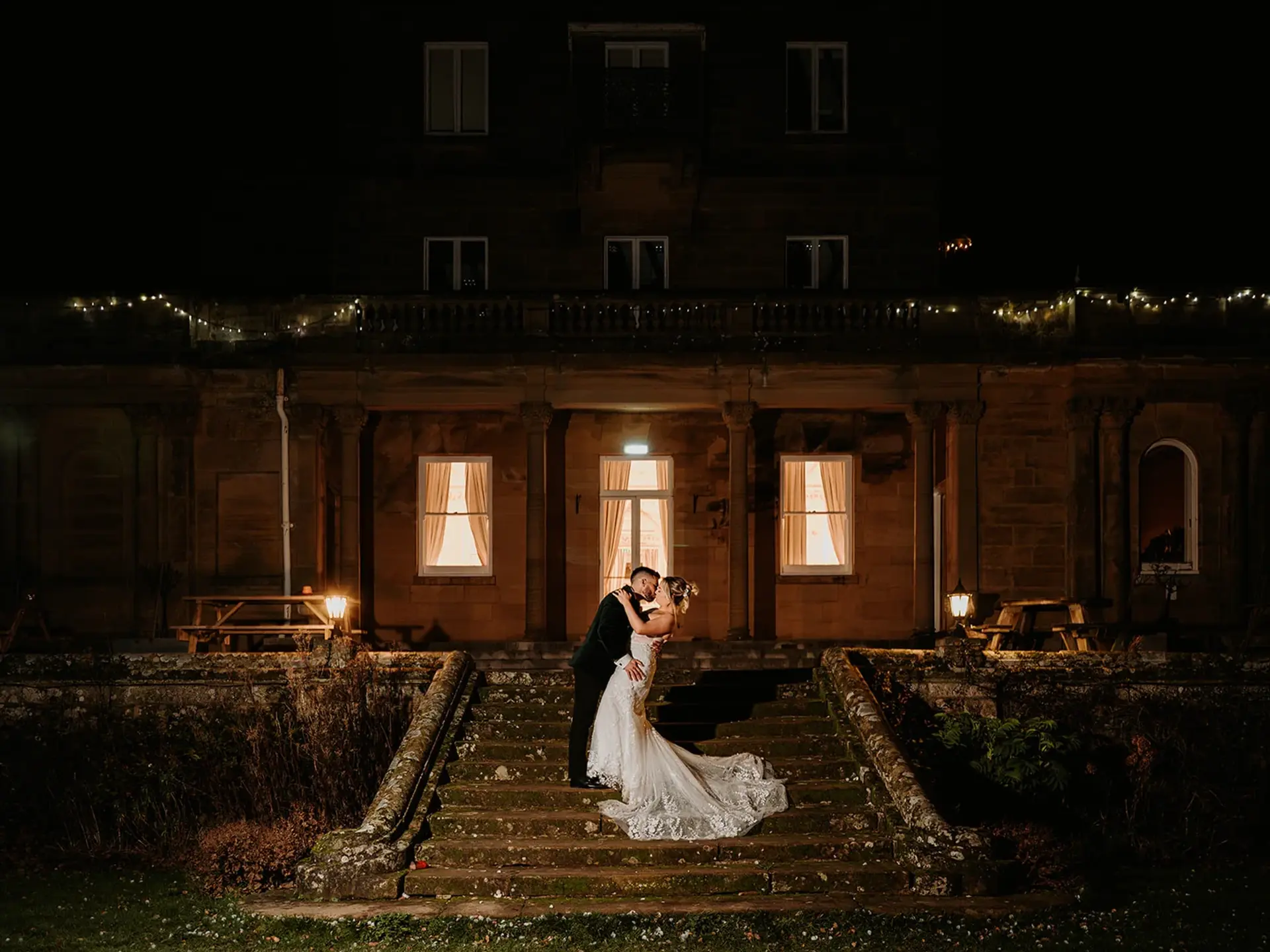 Salomons Estate at night with fairy lights and lit windows