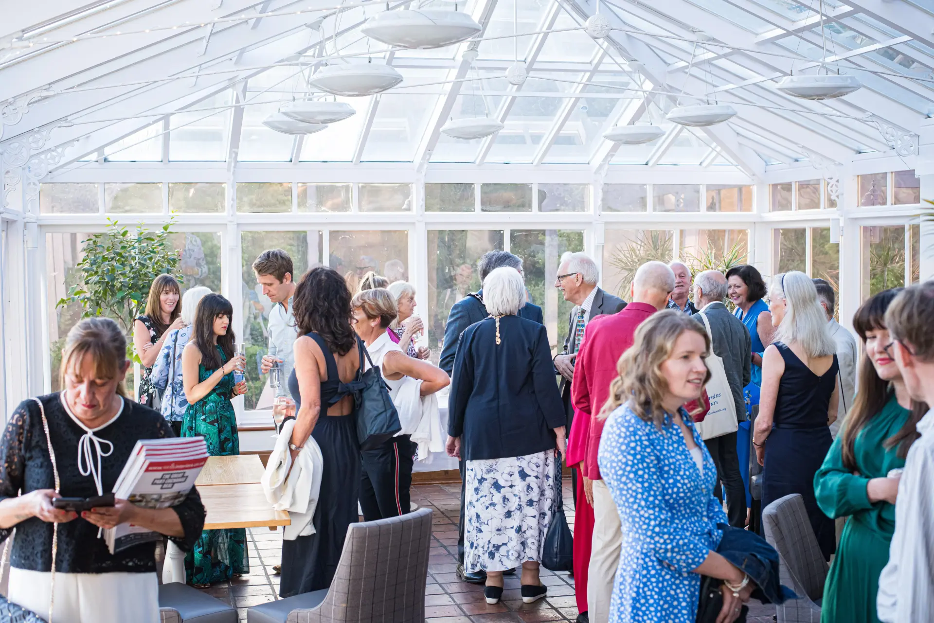 Corporate event in the Conservatory with guests networking at Salomons Estate
