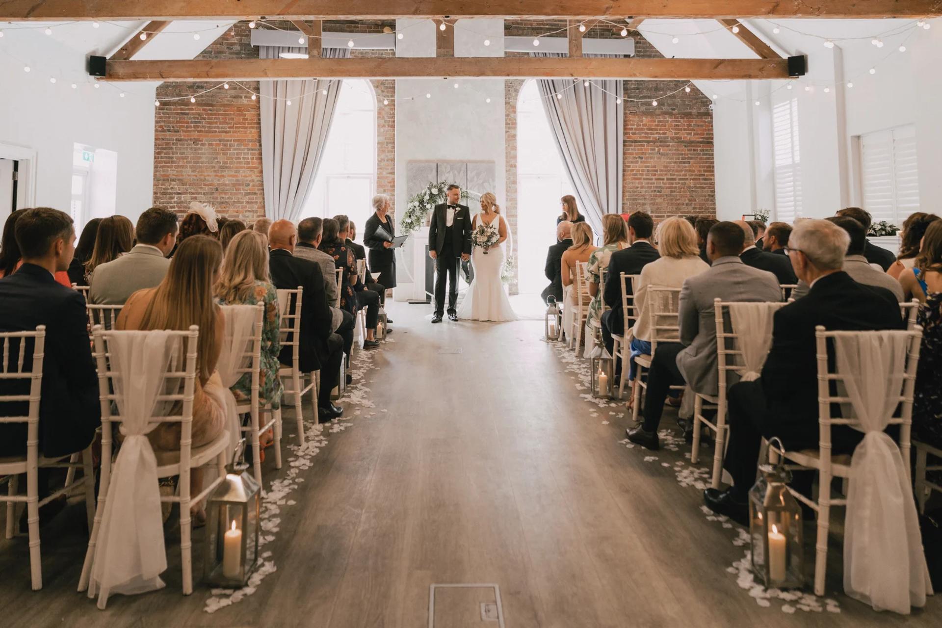 Joyful guests watching the wedding ceremony