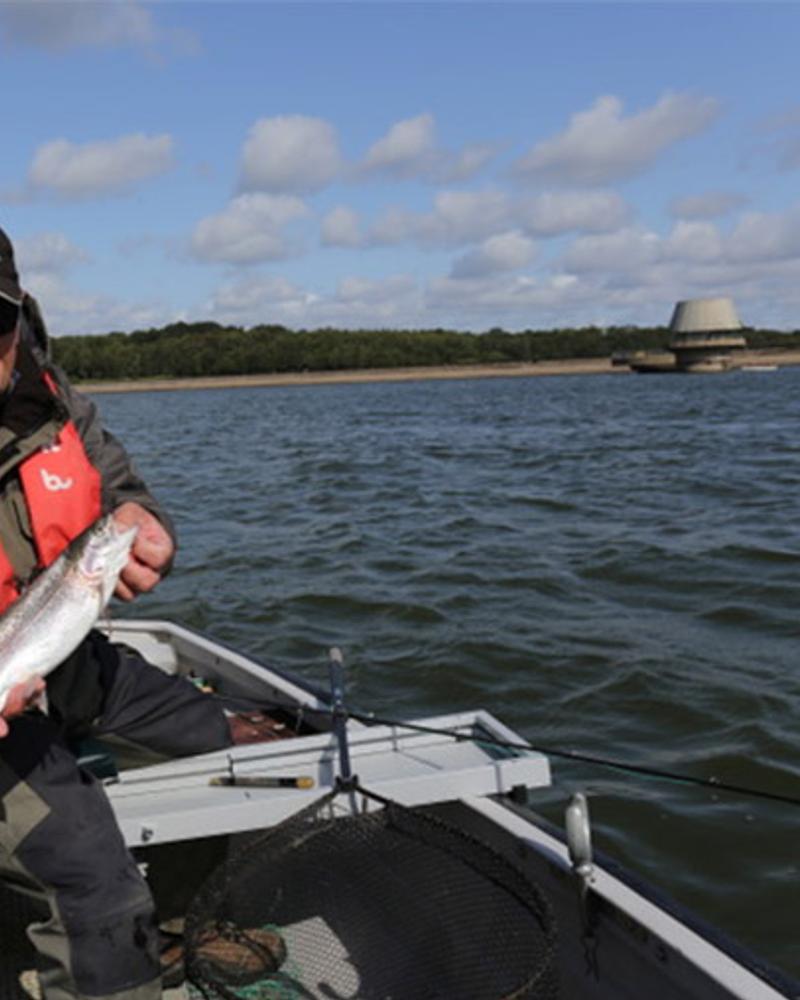 Angler with a rainbow trout caught at Bewl Water