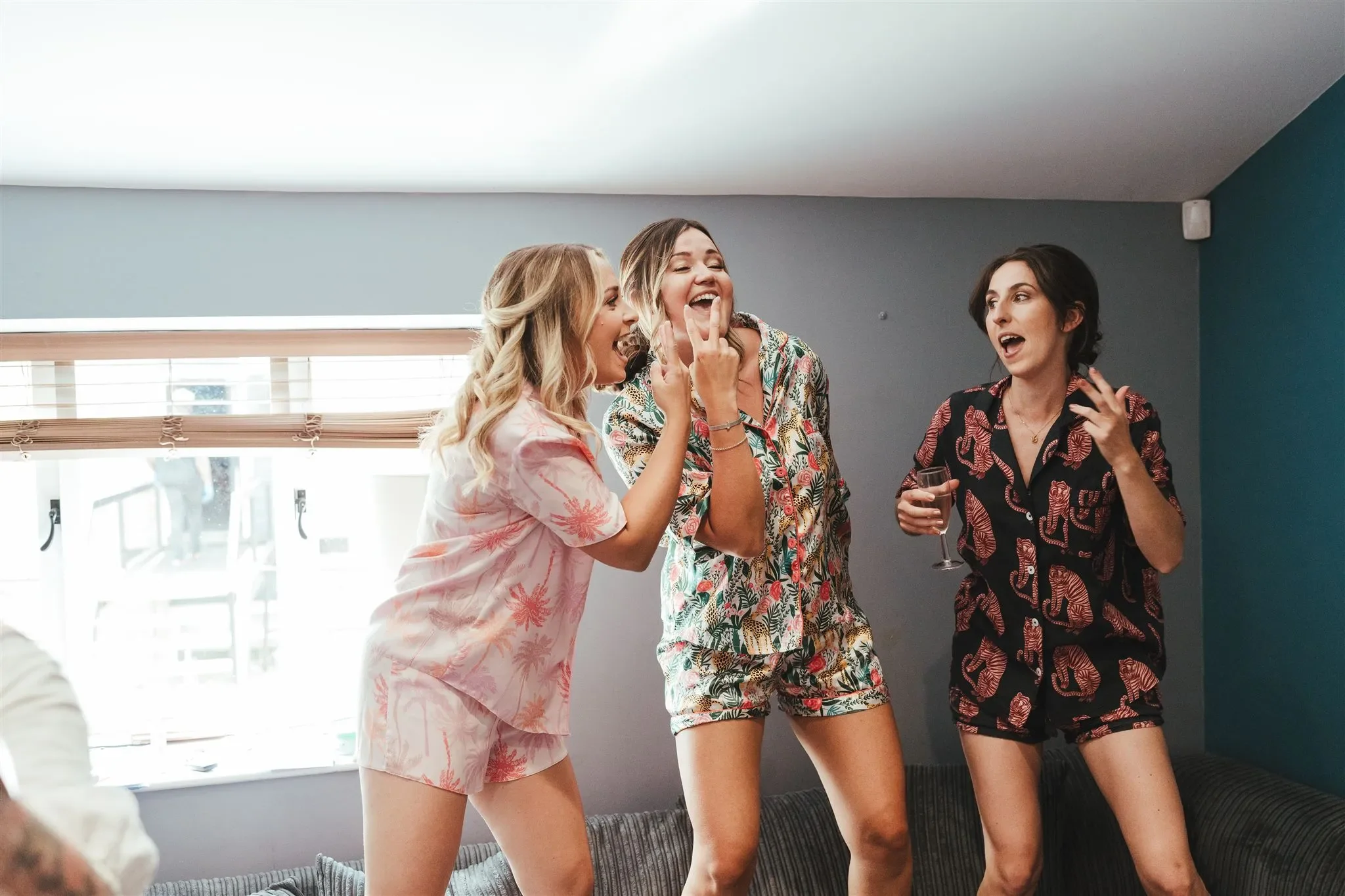 Hen party group laughing together in matching pyjamas at Salomons Estate